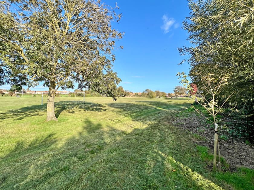 View to secure playing field accessed from rear gate | Meadow View, Weymouth