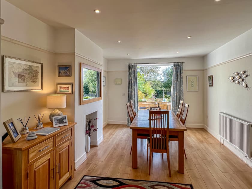 View from dining area to garden and terrace | Meadow View, Weymouth