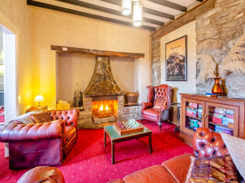 Living room with open fire | Noddfa, Harlech
