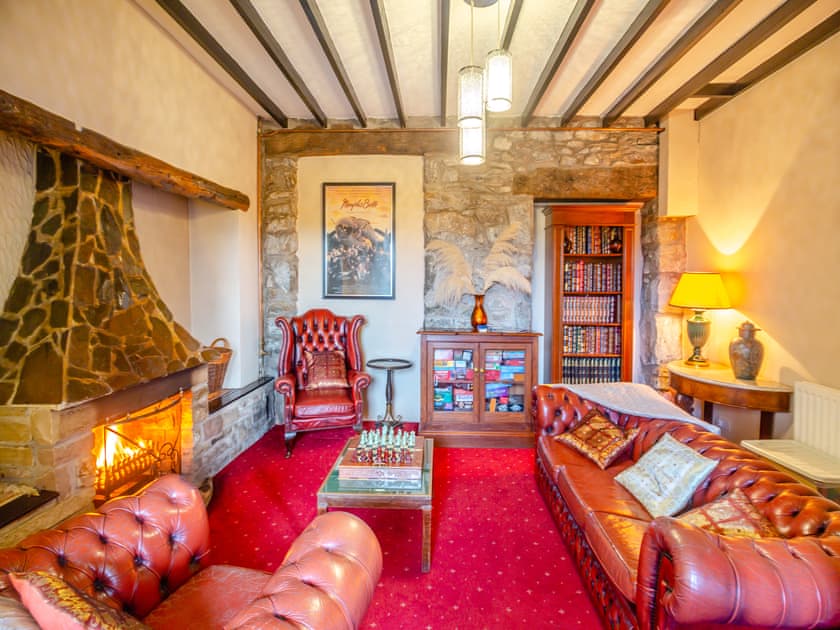 Living room with open fire | Noddfa, Harlech