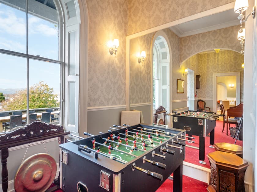 Entertaining table football game within the entrance hall | Noddfa, Harlech