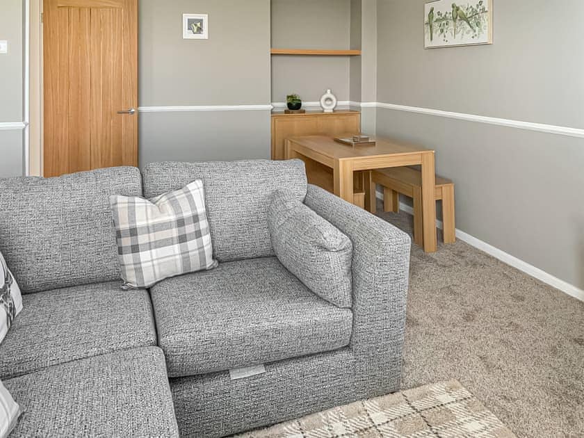 Living room/dining room | Sunrise Cottage - Bron Y Wendon Holiday Park, Llanddulas, near Llandudno