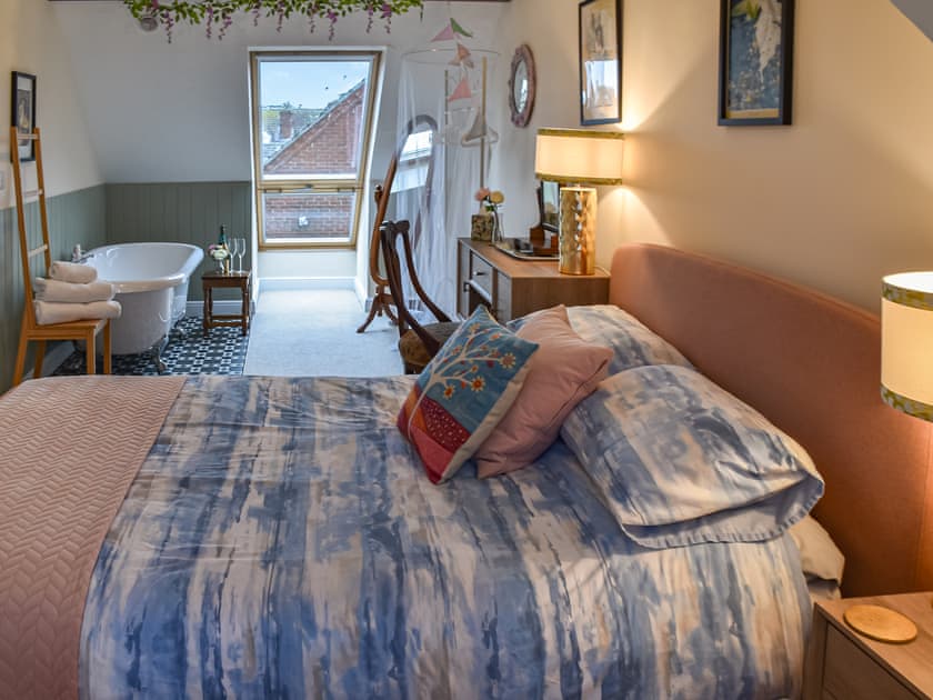 King size bed with free standing bath  | Harbour View Villa, Gorleston-on-Sea, near Great Yarmouth