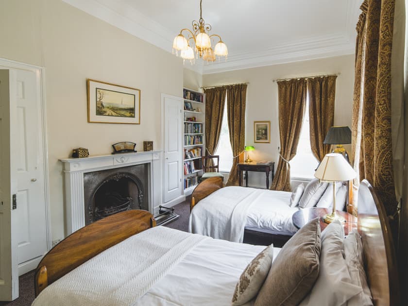 Characterful twin bedroom with feature fireplace | The Sedgeford Hall - Sedgeford Hall Estate , Sedgeford, near Hunstanton