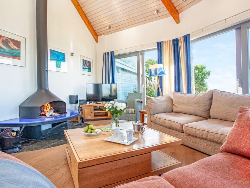Fabulous open plan living space leading onto decked terrace | Shark Fin, Sennen