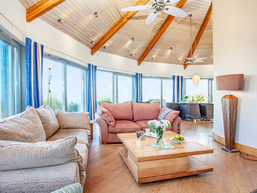 Fabulous open plan living space leading onto decked terrace | Shark Fin, Sennen