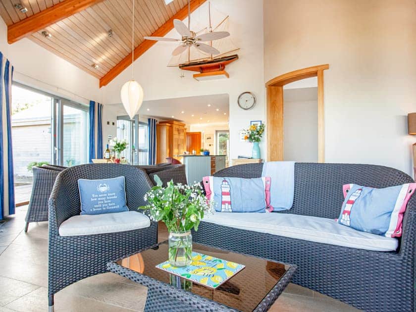 Fabulous open plan living space leading onto decked terrace | Shark Fin, Sennen