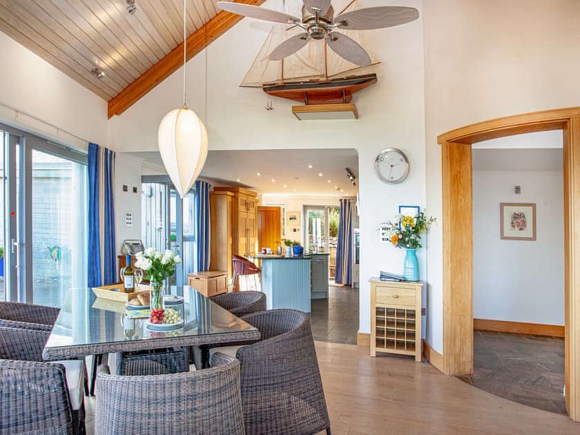 Dining area leading through to the impressive bespoke kitchen | Shark Fin, Sennen