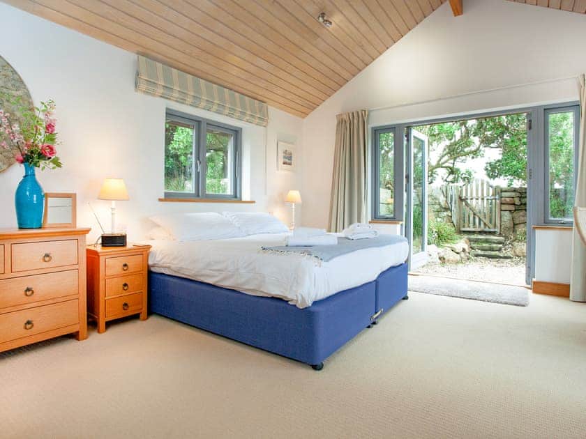 6ft double bedroom with french doors to patio | Shark Fin, Sennen