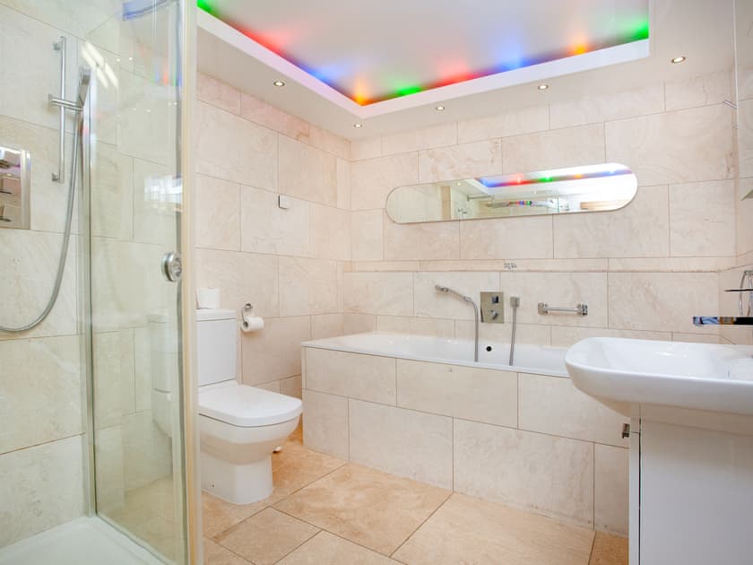 Luxurious bathroom featuring mood lighting | Shark Fin, Sennen