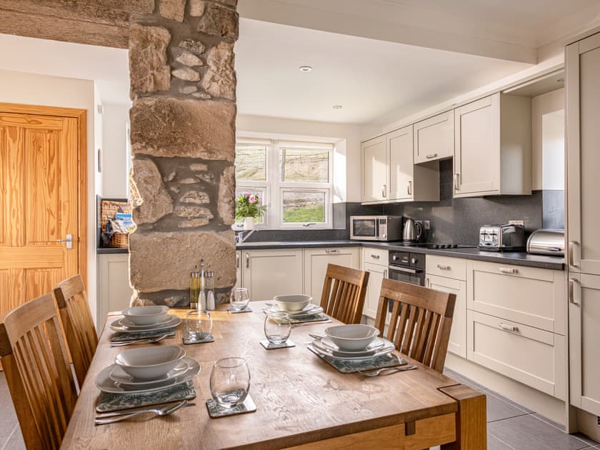 Lovely kitchen/diner with exposed stonework | Tornahatnach - Glenkindie Estate Holiday Cottages, Glenkindie, near Alford
