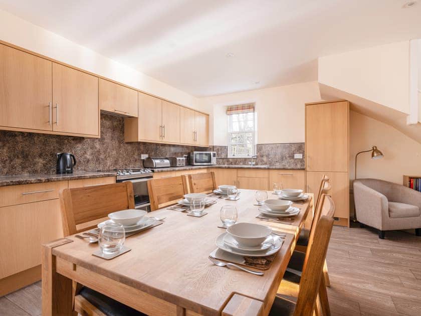 Well-equipped kitchen and convenient dining area | Home Farm Cottage - Glenkindie Estate Holiday Cottages, Glenkindie, near Alford