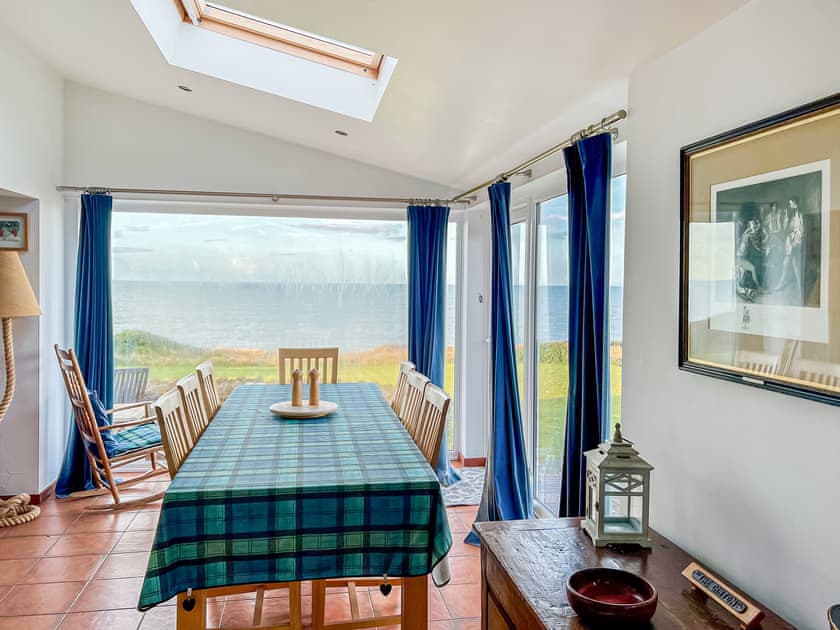  Dining room/conservatory/snug with tiled floor | Greenbanks, Chesil Beach, near Abbotsbury