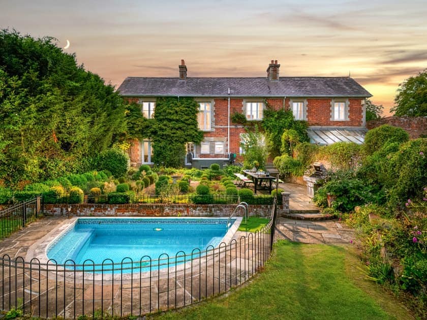 Rear lawned garden and swimming pool | Downwood Vineyard, Blandford