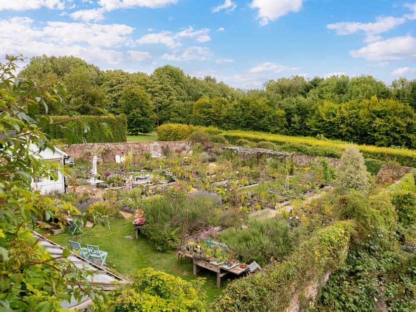 Paved patio with hot-tub | Downwood Vineyard, Blandford