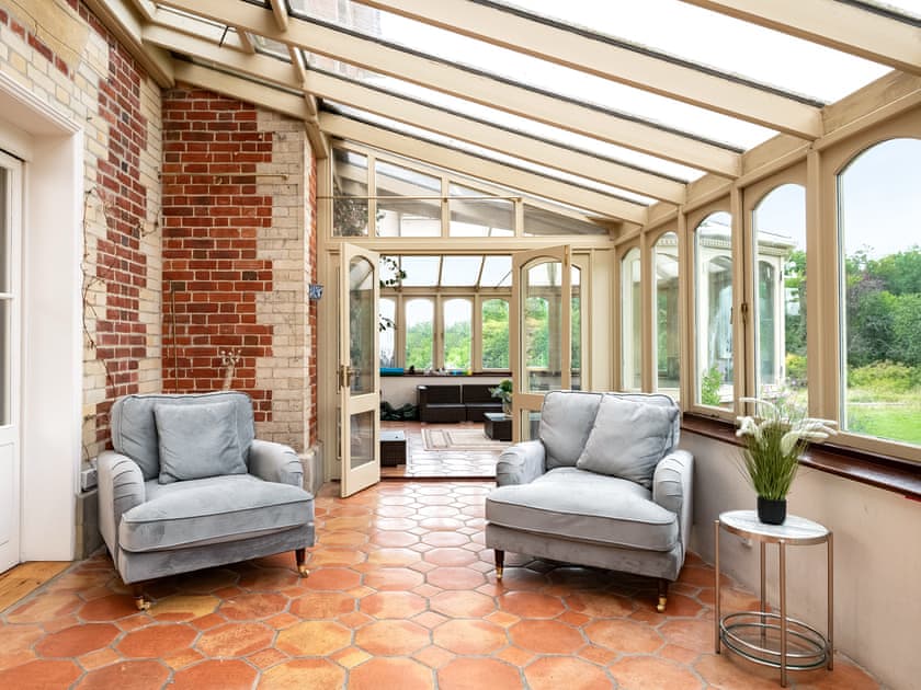 Comfortable seating in the conservatory | Downwood Vineyard, Blandford