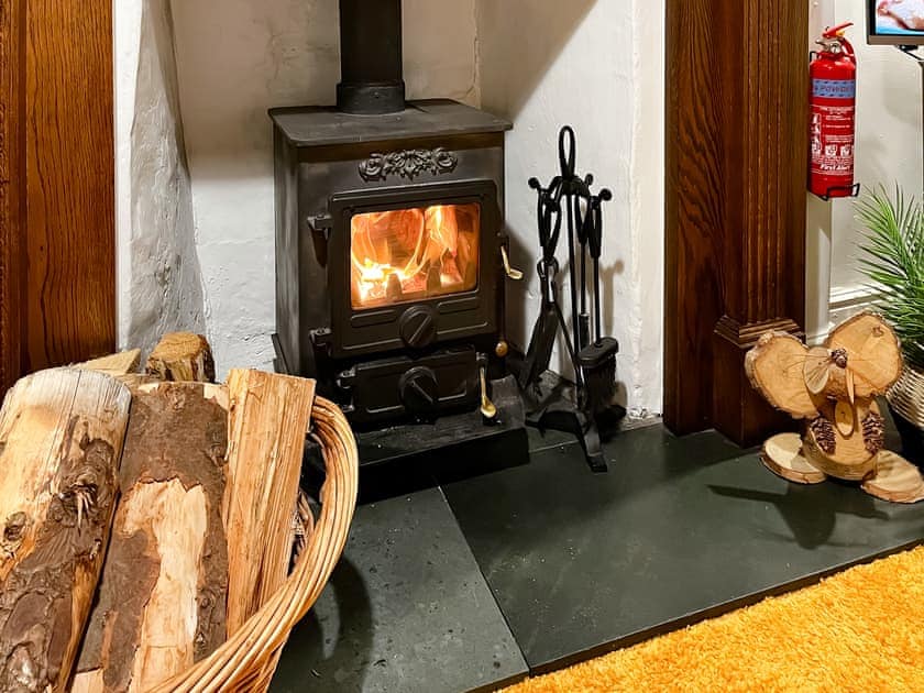 Characterful living room with wood burner | Hidden Cottage, Lowick, near Coniston