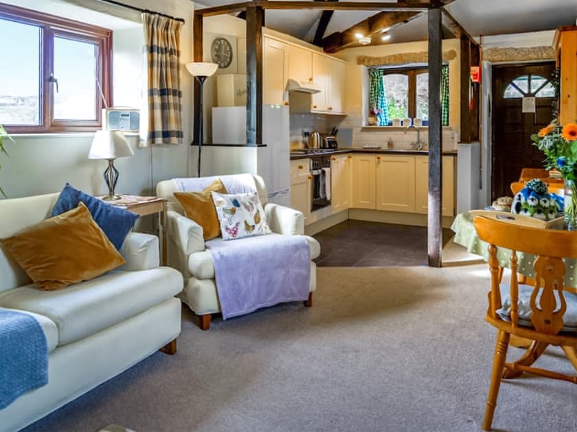 Cosy furniture in living area | The Byre - Mennabroom Farm Cottages, Warleggan, near Bodmin