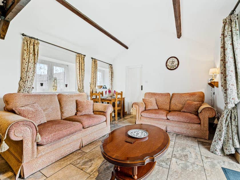 Sitting room with log burning stove | The Cottage - Midknowle Farm Cottages, South Barrow, near Yeovil