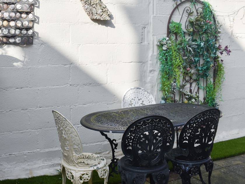 Rear garden with BBQ around the corner, side access to the front of the house | Avondale, Clacton on Sea