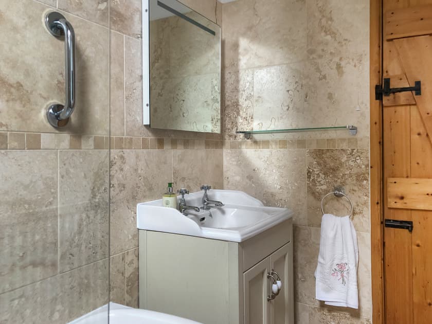 Family bathroom with shower over bath | The Mill House, Lea, near Ross-on-Wye