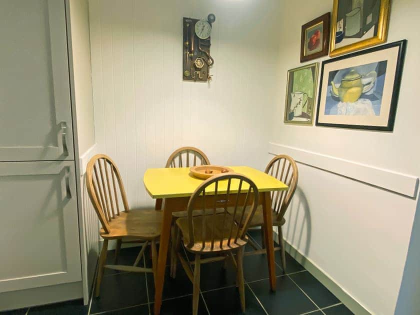 Kitchen dining Area, showing door to the utility and backdoor | Am Bothan, Naast, near Poolewe