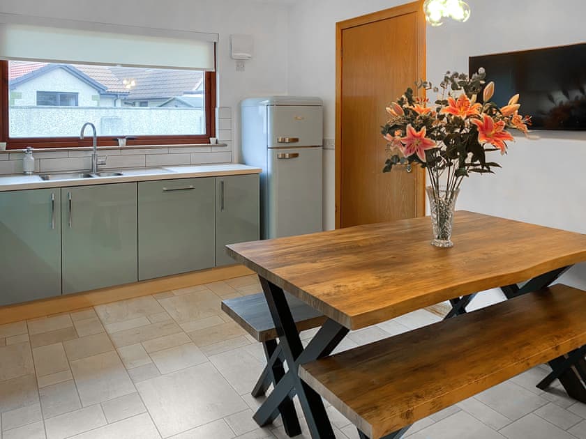 Stylish dining area with wall mounted TV | Ben The Hoose, Anstruther