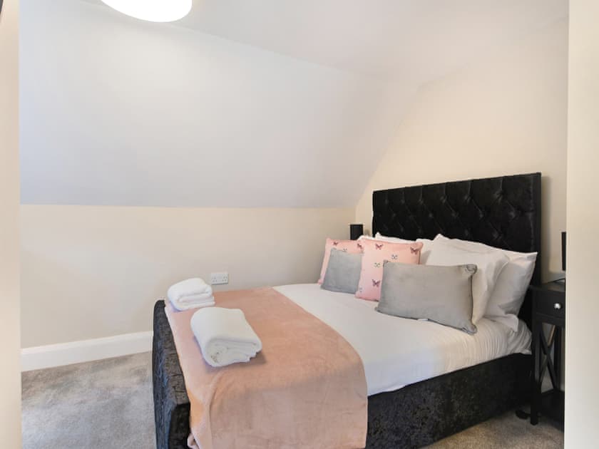 Bedroom 4 with open plan bathroom  | Beaconsfield House, Mundesley