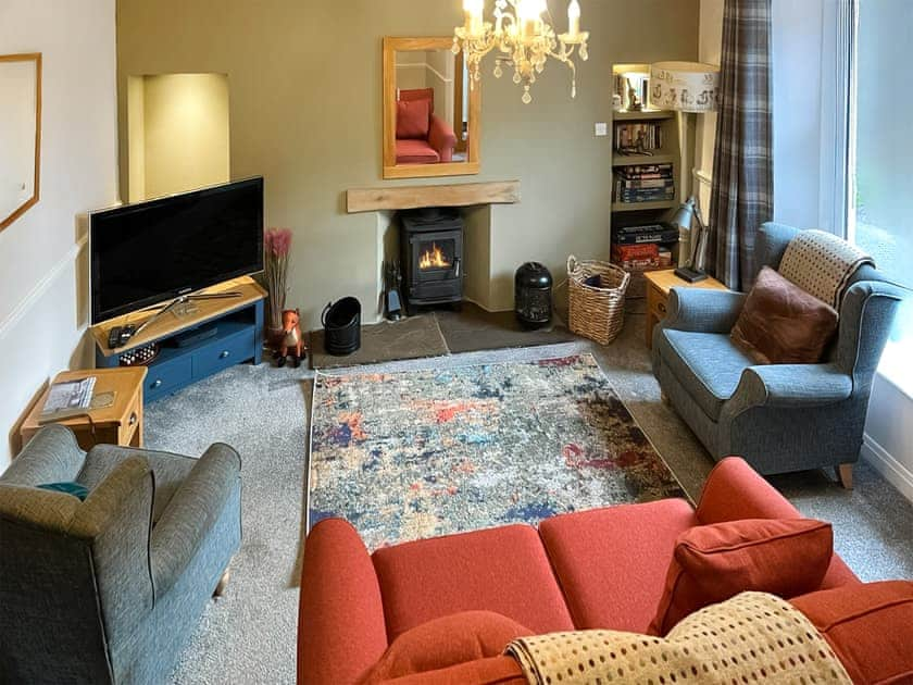 Warm and comfortable living room | 1 Kernot Court, Reeth