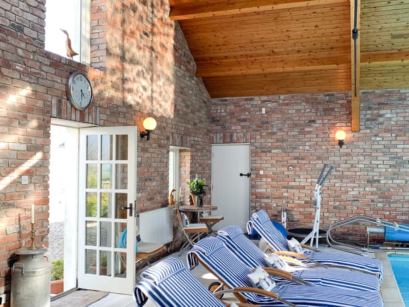 Swimming pool area can be booked at small extra cost | Harlequin House, Holmfirth