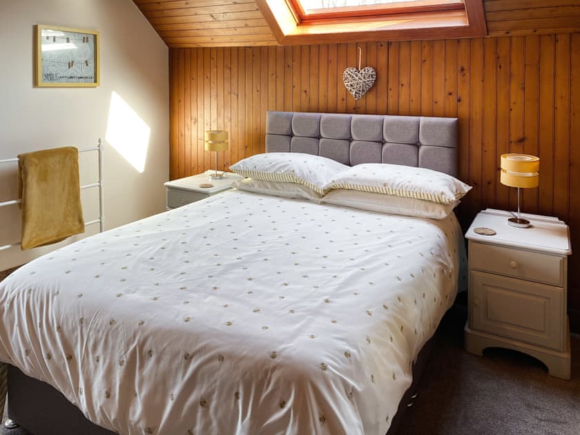 Comfortable double bedroom featuring traditional oak furniture with beautiful views of Kilmichael Glen  | Kirnan Cottage, Kilmichael Glassary, near Lochgilphead