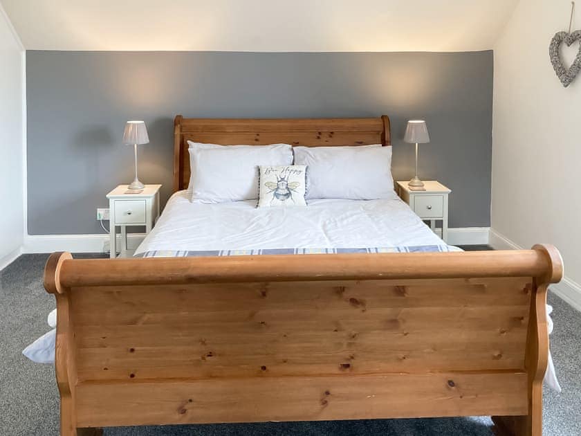Relaxing double bedroom with sleigh bed | Halleaths Home Farm, Lochmaben