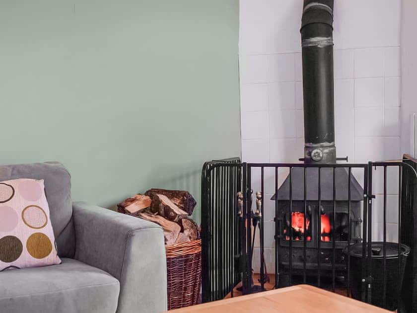 Welcoming living room with wood burner | Stream Cottage - Triscombe Farm Country Cottages, Wheddon Cross, Exmoor