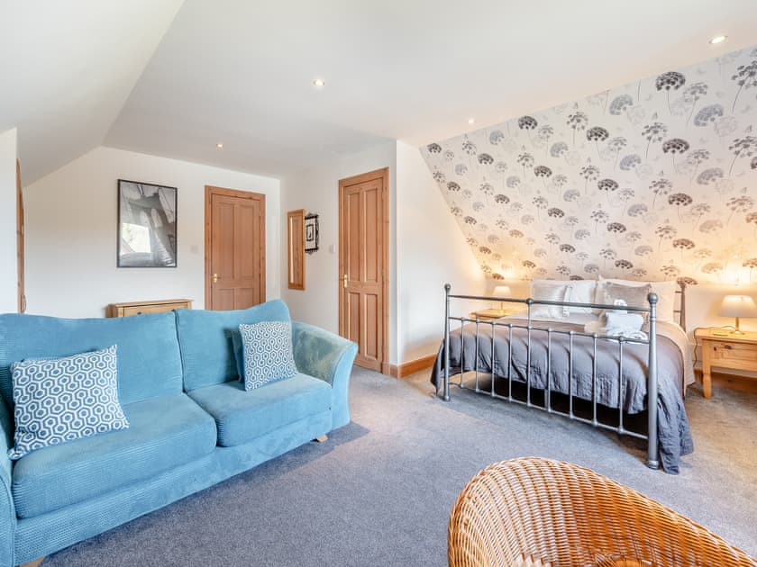 Seating area in the master bedroom | Croftside House - Allt Mor Cottages, Aviemore