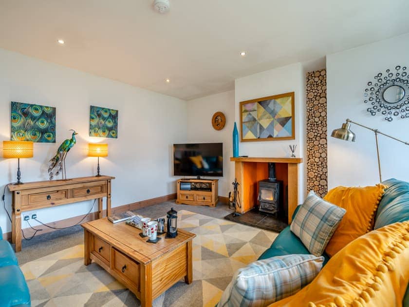 Warm and comfortable living room with woodburner | Cairn View - Allt Mor Cottages, Aviemore
