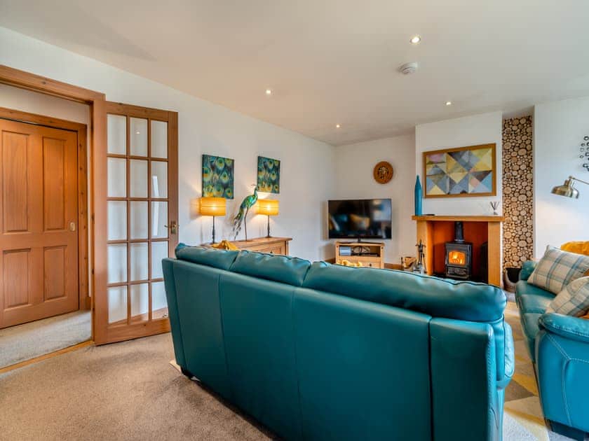 Warm and comfortable living room with woodburner | Cairn View - Allt Mor Cottages, Aviemore