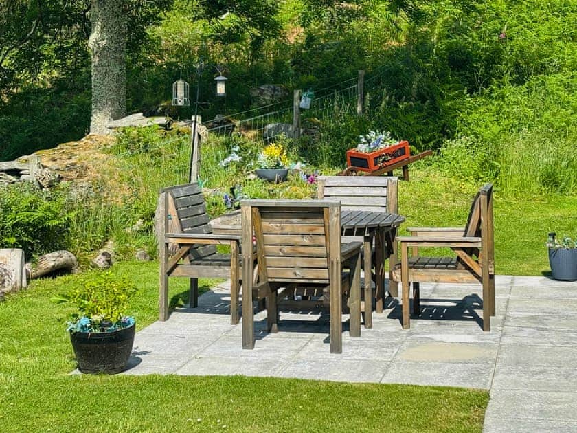 Tranquil patio for outdoor dining. Enjoy a morning coffee, al fresco lunch and dinner or relax with a chilled glass in the evening watching the sun set over the valley | Lyon Lodge, Aberfeldy