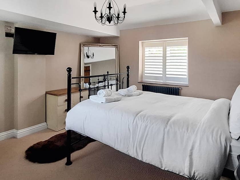 Master bedroom with shutters | Mill House, Lowestoft