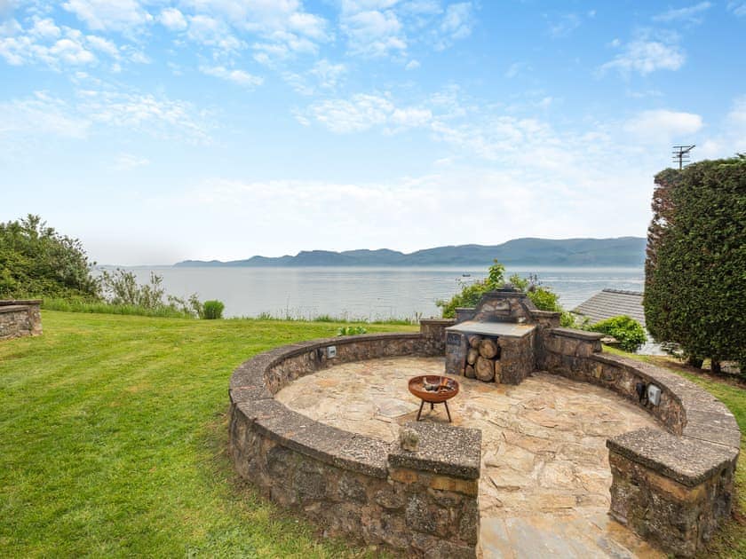 Outdoor area | Ty Glan Mor (The Beach House) - Water’s Edge Cottages, Llanfaes, Beaumaris, Anglesey