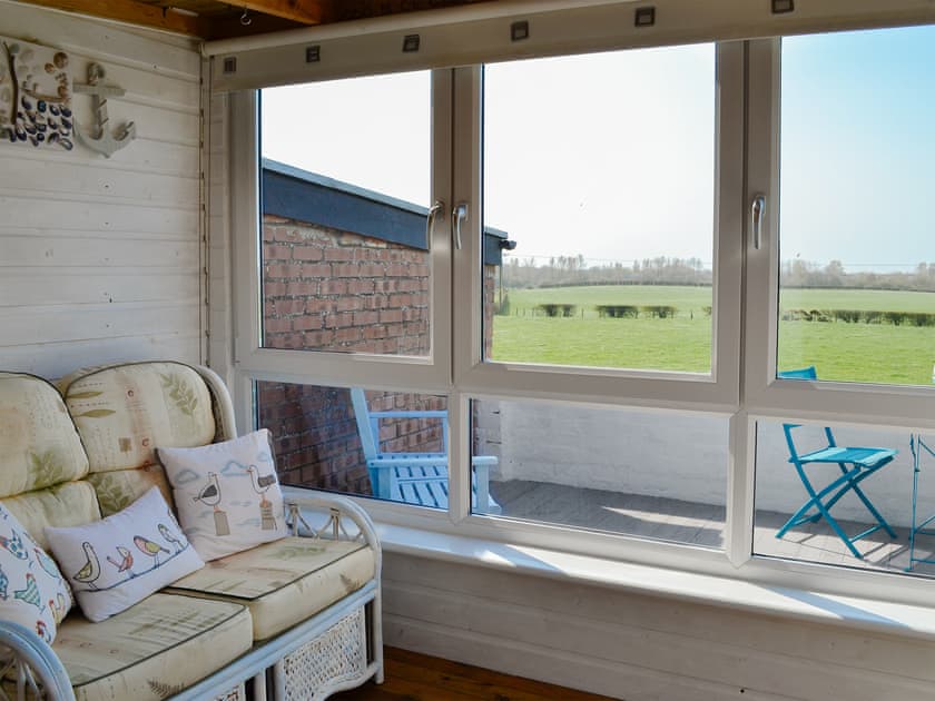 Relaxing sun room | Honeysuckle Cottage, Dreghorn, near Irvine