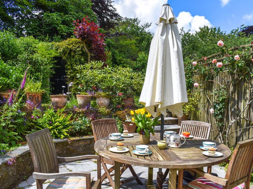 Outdoor eating area | Hollyhocks Cottage, Hellandbridge, near Bodmin