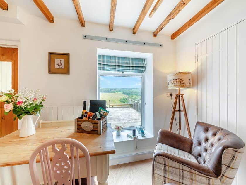 Living area looking out onto the stunning Northumberland landscape | Lake View Cottage, Yarrow Moor, near Bellingham