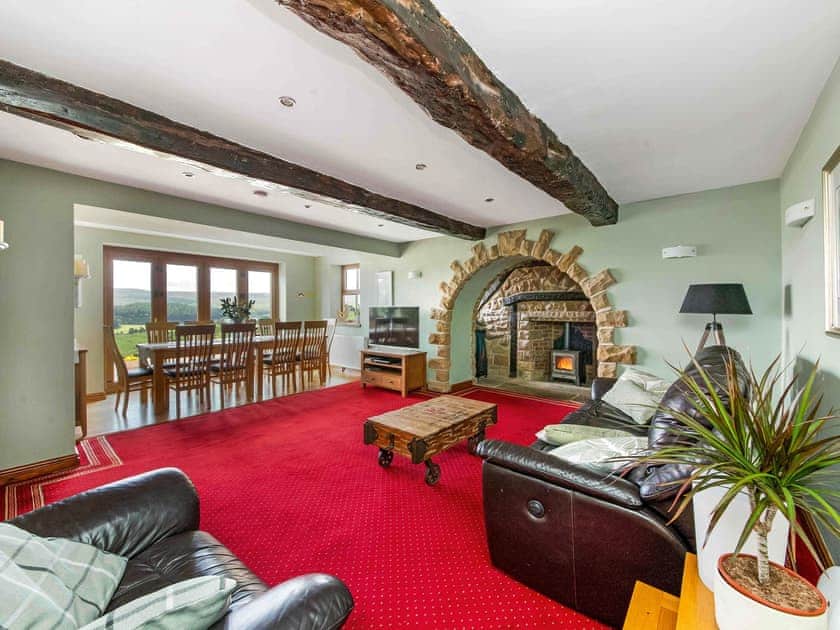 Stine flagged living area with beamed ceiling | Cote Farm, Langsett, near Penistone