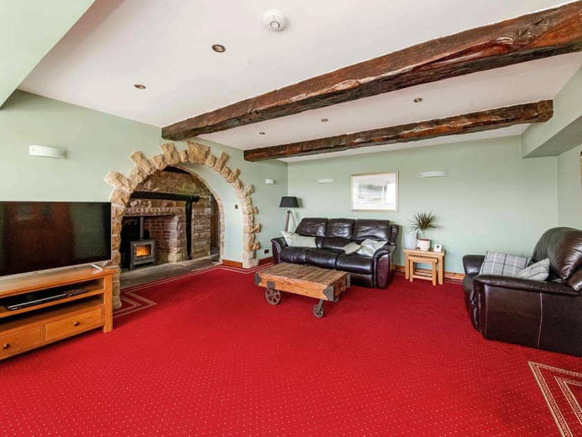 Stine flagged living area with beamed ceiling | Cote Farm, Langsett, near Penistone