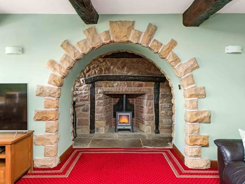Stine flagged living area with beamed ceiling | Cote Farm, Langsett, near Penistone