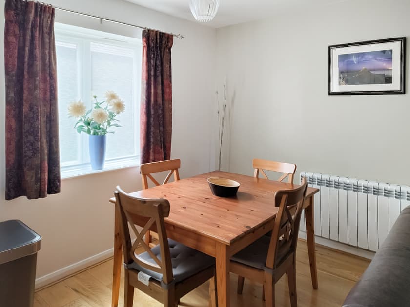 Comfortable living area and dining table and chairs | Erskine Cottage, Seahouses