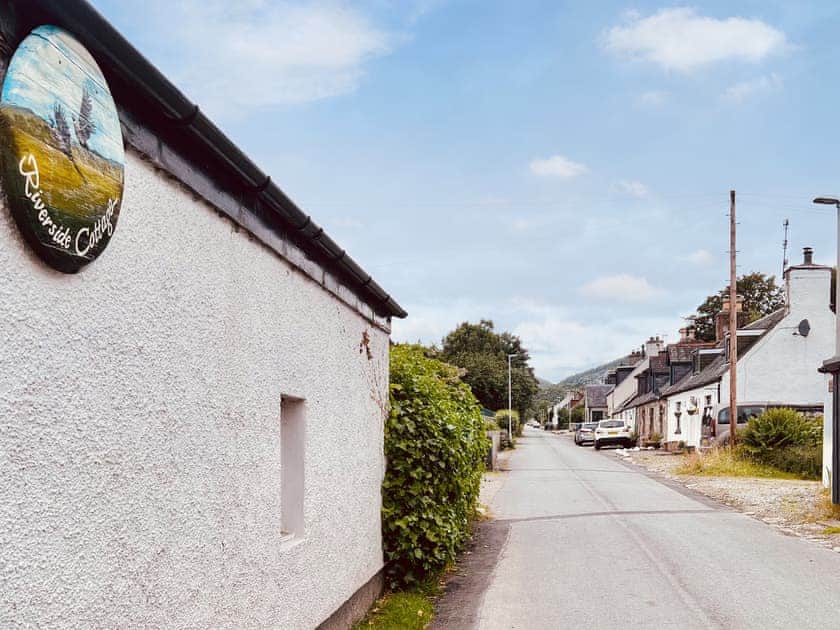 Exterior of Riverside Cottage, it sits on a single track road in the small village of Lewiston. There is off street parking to the side of the cottage | Riverside Cottage, Drumnadrochit, near Loch Ness