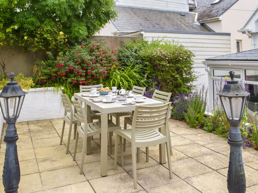 Sitting-out-area | Ffin Yr Afon - Gwbert Holiday Cottages, Gwbert, near Cardigan