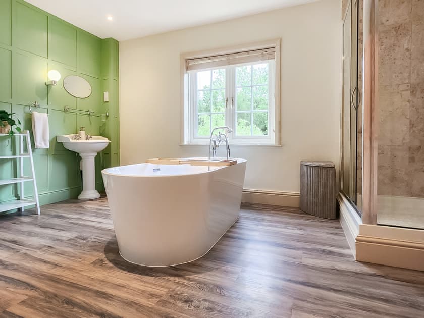 Wonderful bathroom with free-standing roll top bath | Pigeon Coo Farmhouse, Hamstead, near Yarmouth