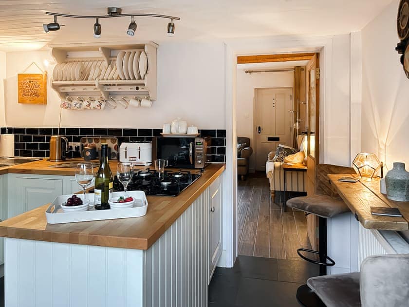 Well-equipped fitted kitchen and breakfast bar or work station  | Time Cottage, Coltishall, near Wroxham